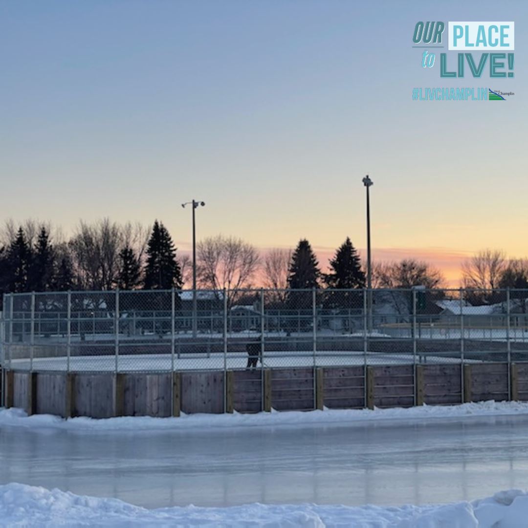 A view of an outdoor rink in Champlin with logo.
