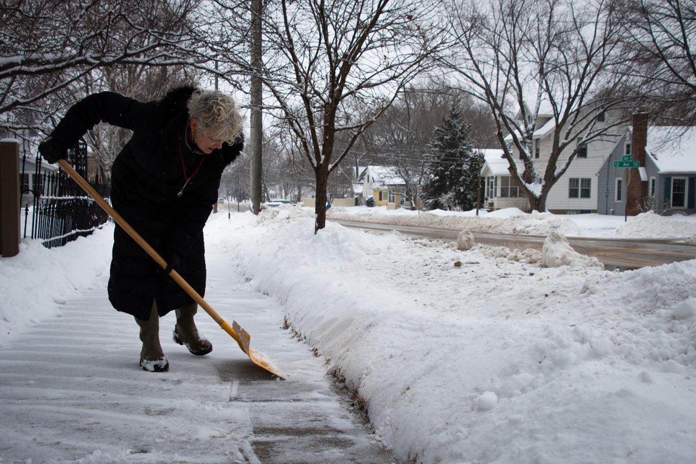 Resident Shoveling Snow
