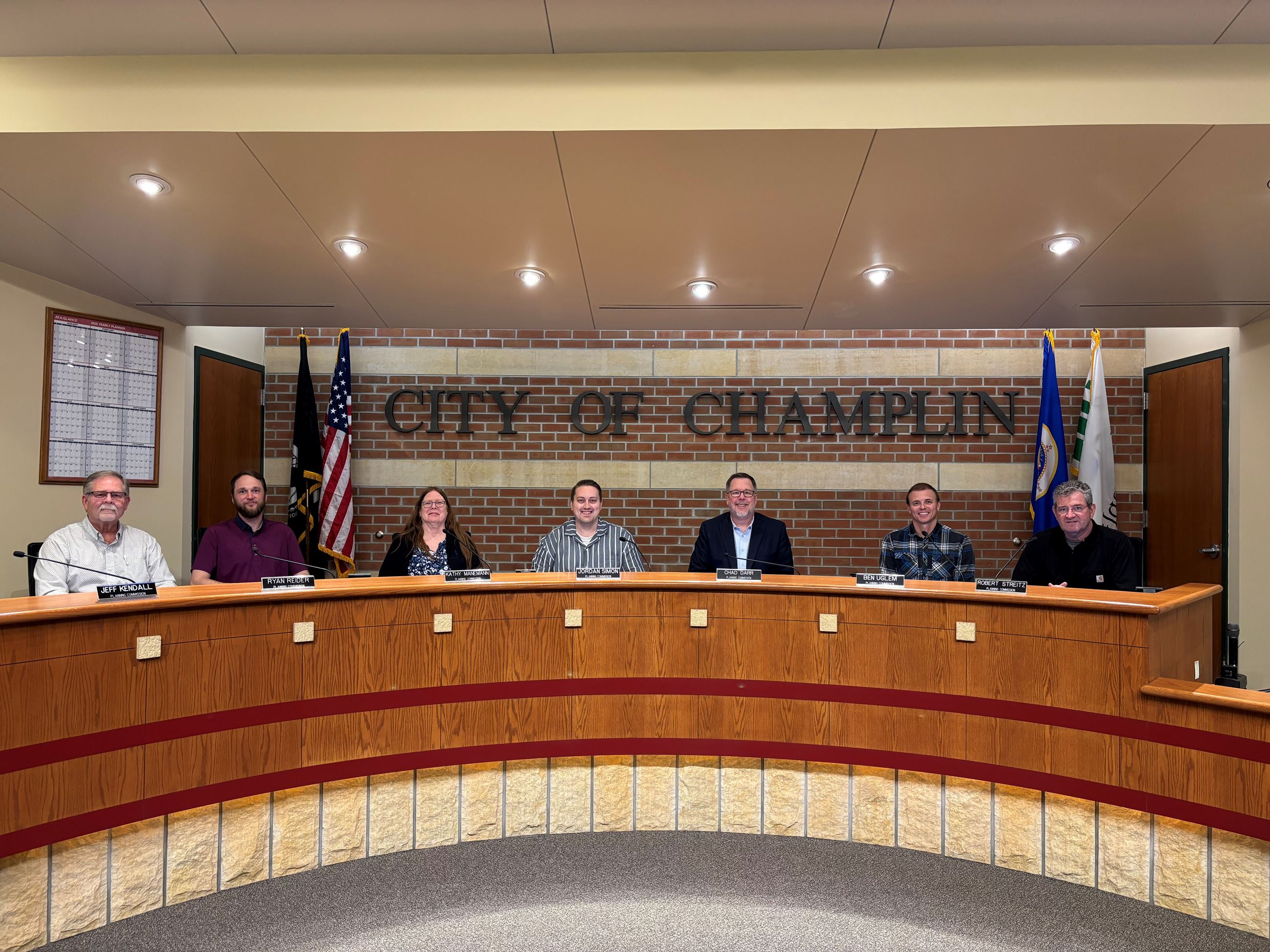 Photo of the Planning Commission in April 2025 sitting behind the Chambers dais.